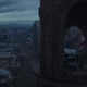 A man in a bell tower rings the alarm.